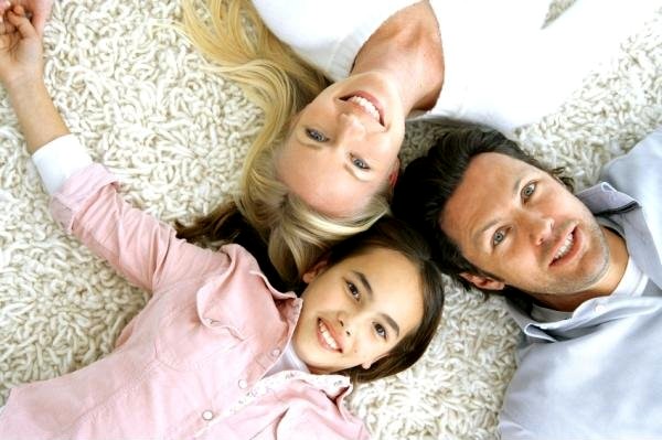 Mother, Father and Daughter on Clean Shag Rug Carpet 